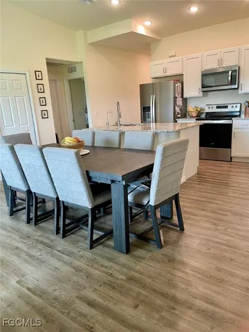 a view of a dining room with furniture