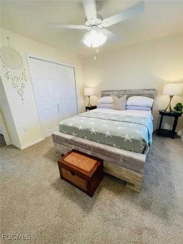 a spacious bedroom with a bed and a table in it