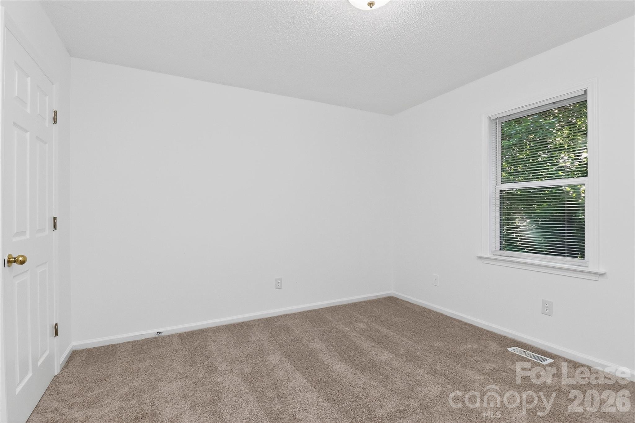 91-93 Sunderland Road Southwest, Unit 93 Concord, NC 28027 - Photo 15 of 30 an empty room with a window