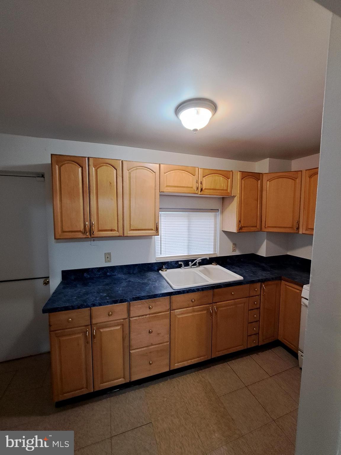 528 Hart Lane Philadelphia, PA 19134 - Photo 4 of 16 a kitchen with granite countertop a sink and cabinets