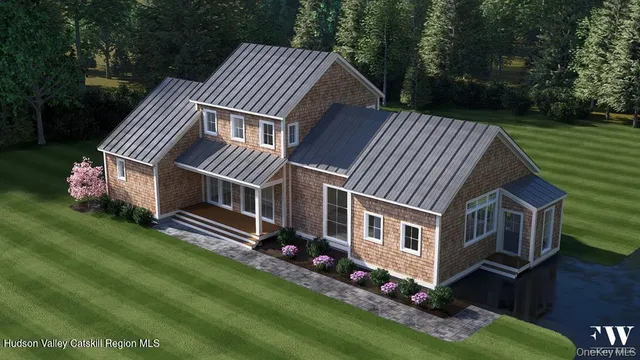 a front view of house with yard and green space