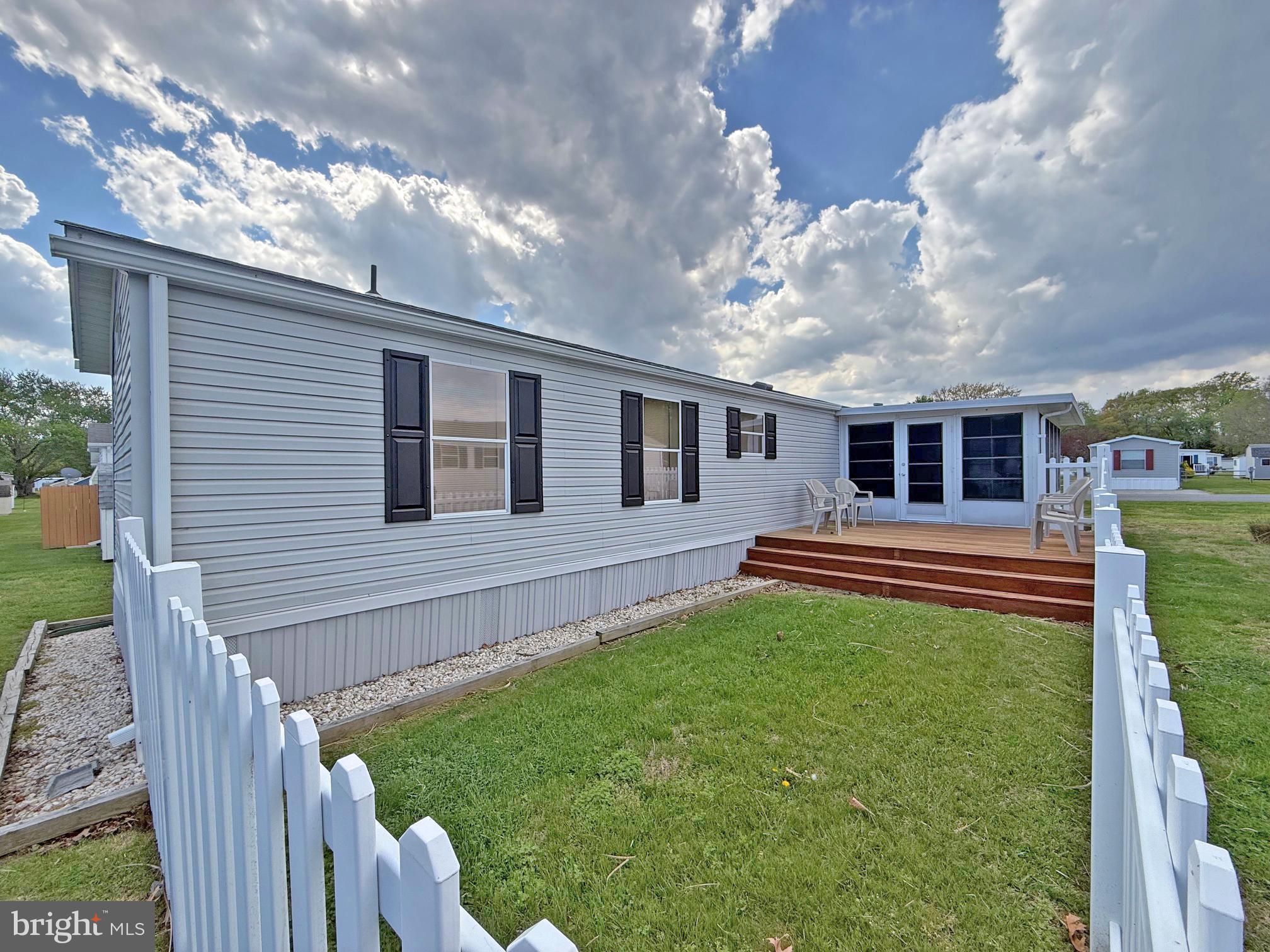 22 Sunnyfield Road, Unit E13 Rehoboth Beach, DE 19971 - Photo 30 of 36 Fenced Yard with Deck #2