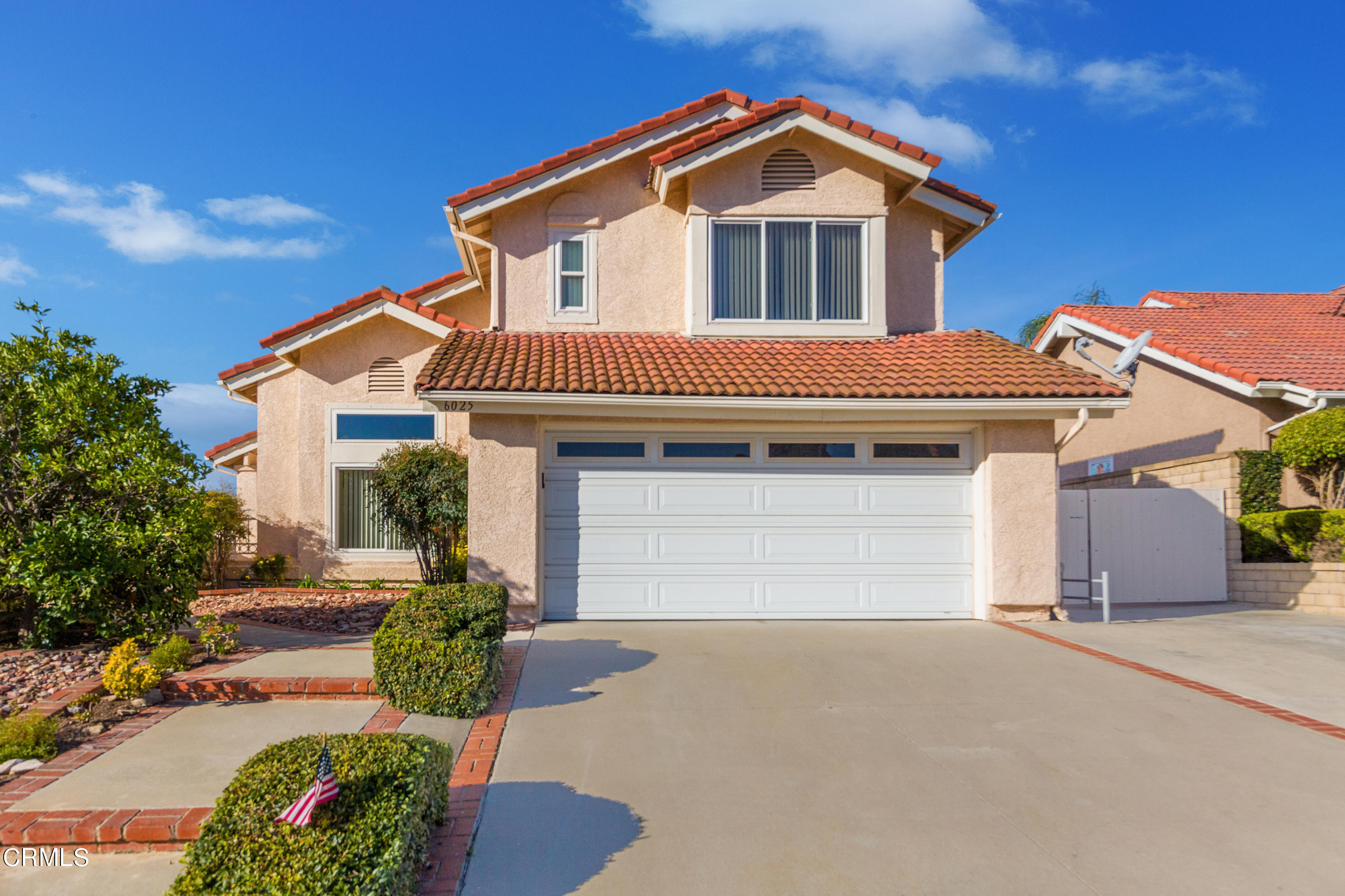 6025 Palomar Circle Camarillo, CA 93012 - Photo 1 of 35 a front view of a house with a yard and garage