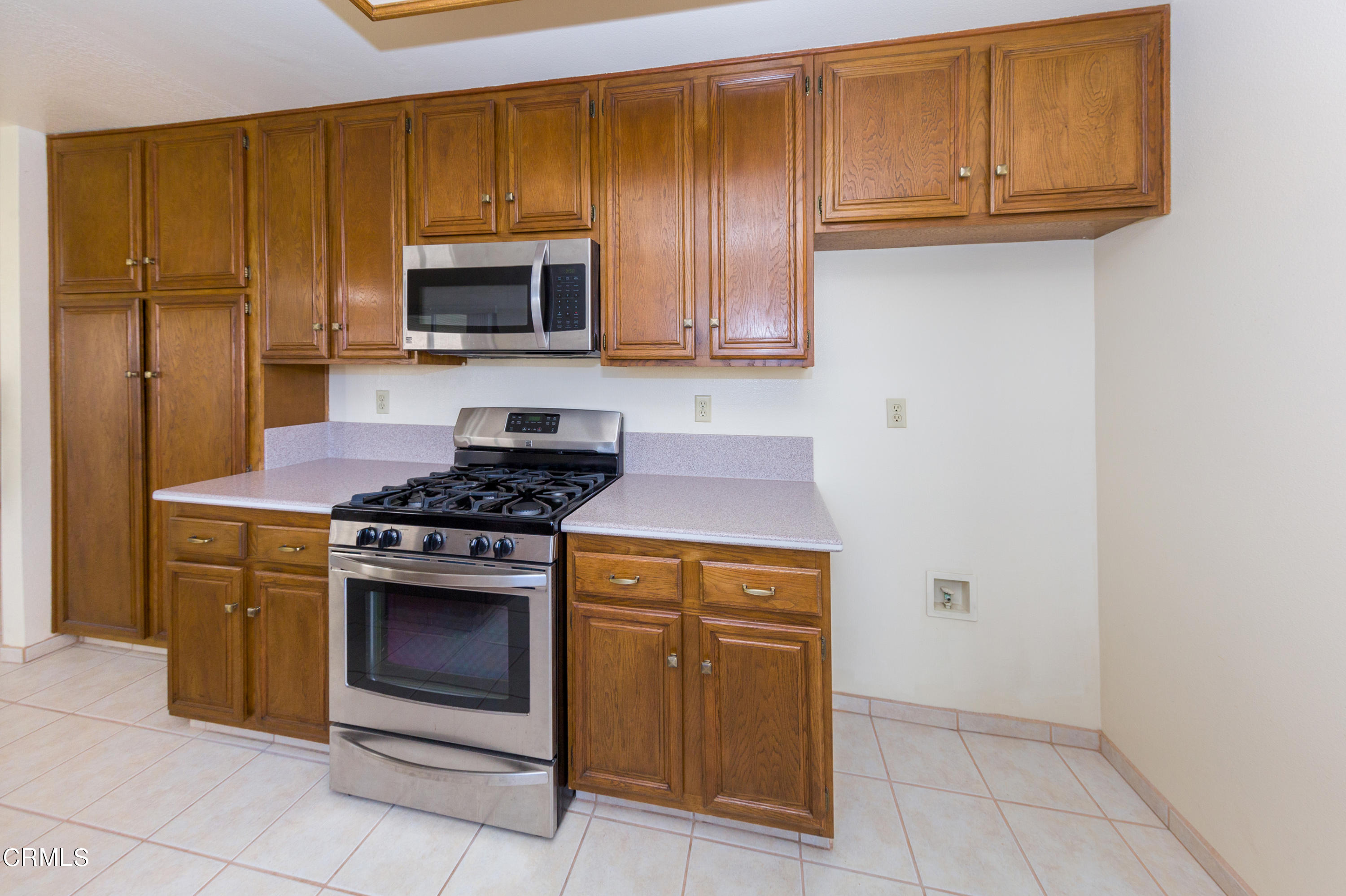 6025 Palomar Circle Camarillo, CA 93012 - Photo 13 of 35 a kitchen with granite countertop cabinets and steel stainless steel appliances