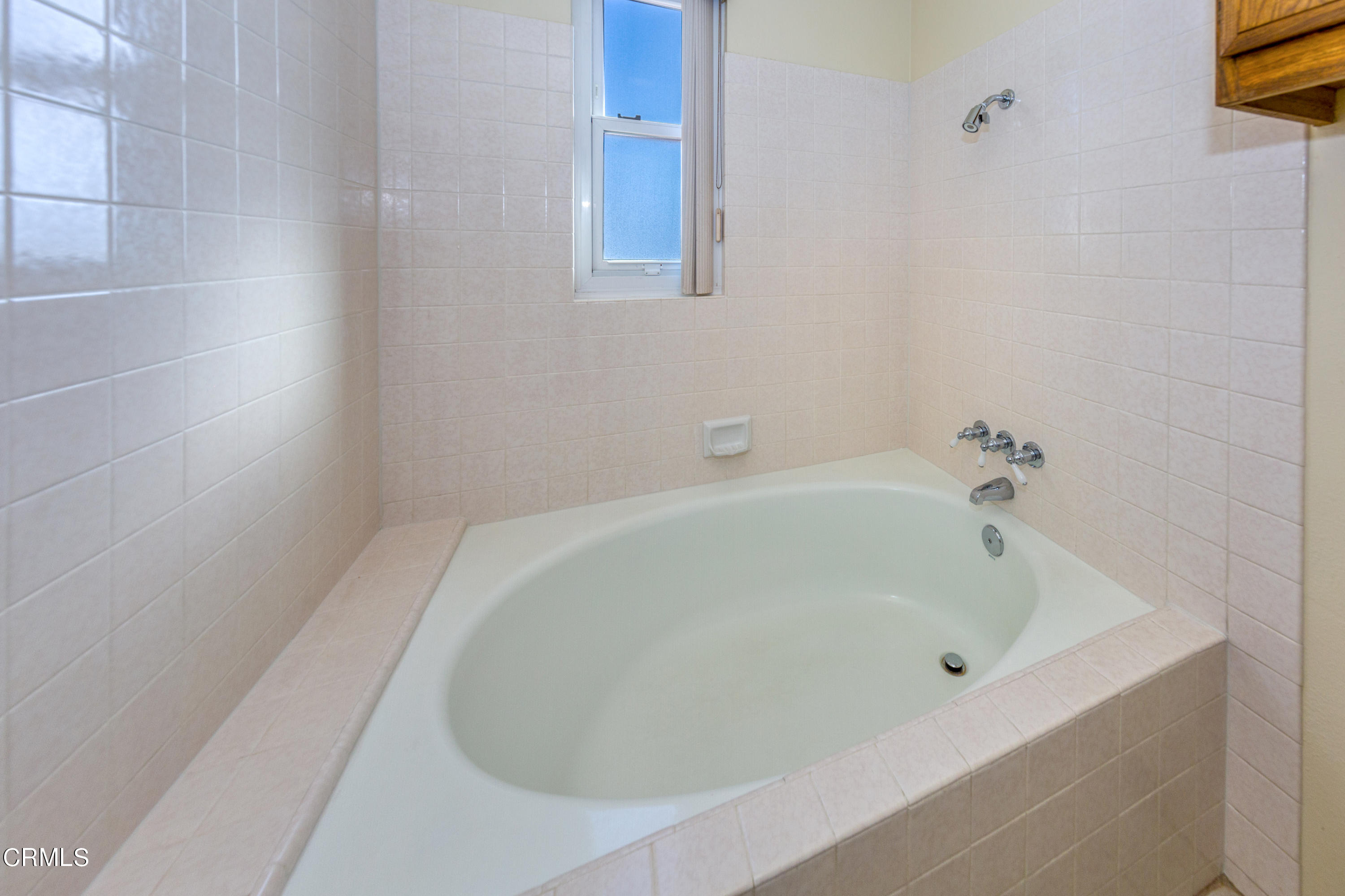 6025 Palomar Circle Camarillo, CA 93012 - Photo 22 of 35 a white bath tub sitting in a bathroom