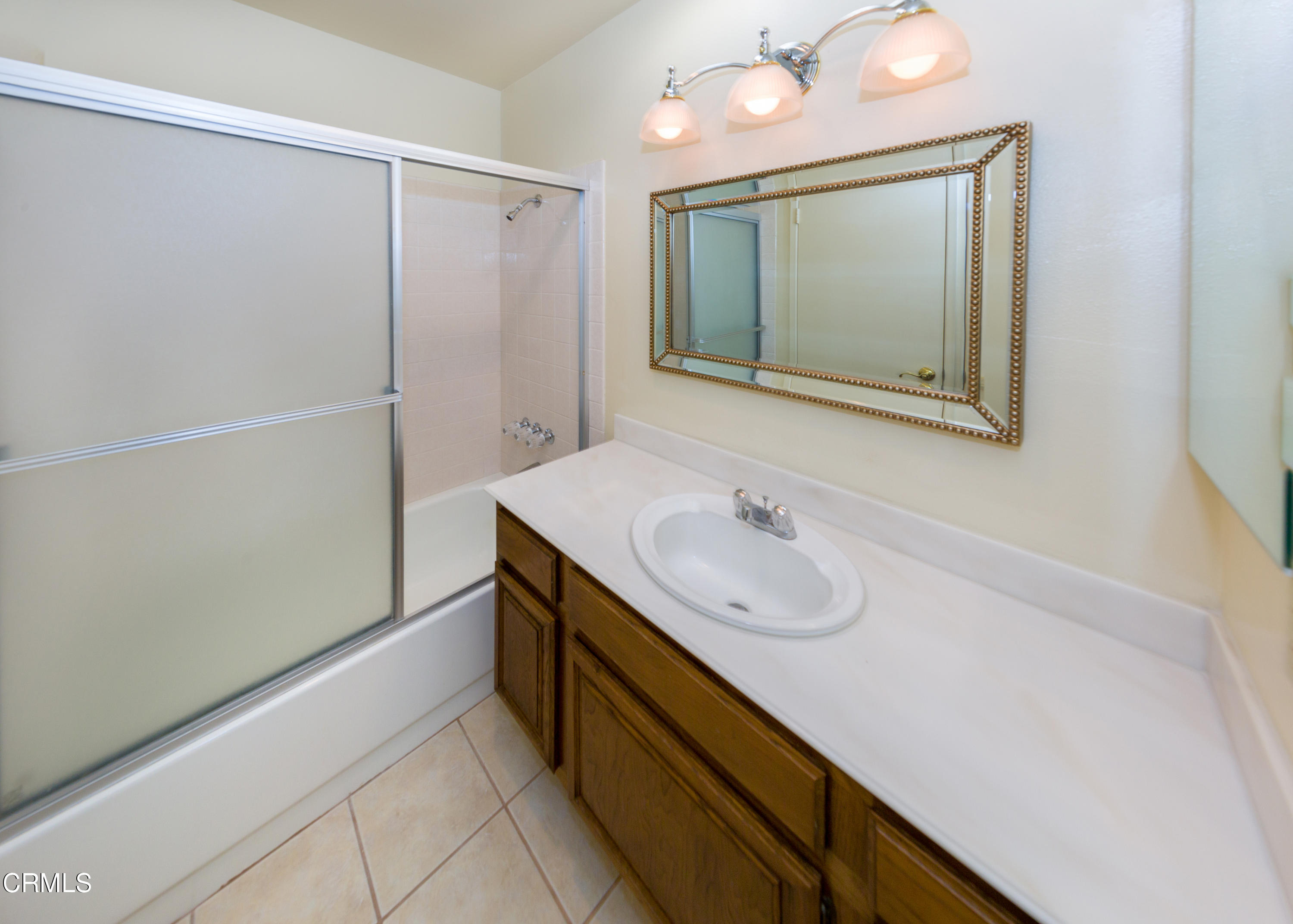6025 Palomar Circle Camarillo, CA 93012 - Photo 23 of 35 a bathroom with a sink and a mirror