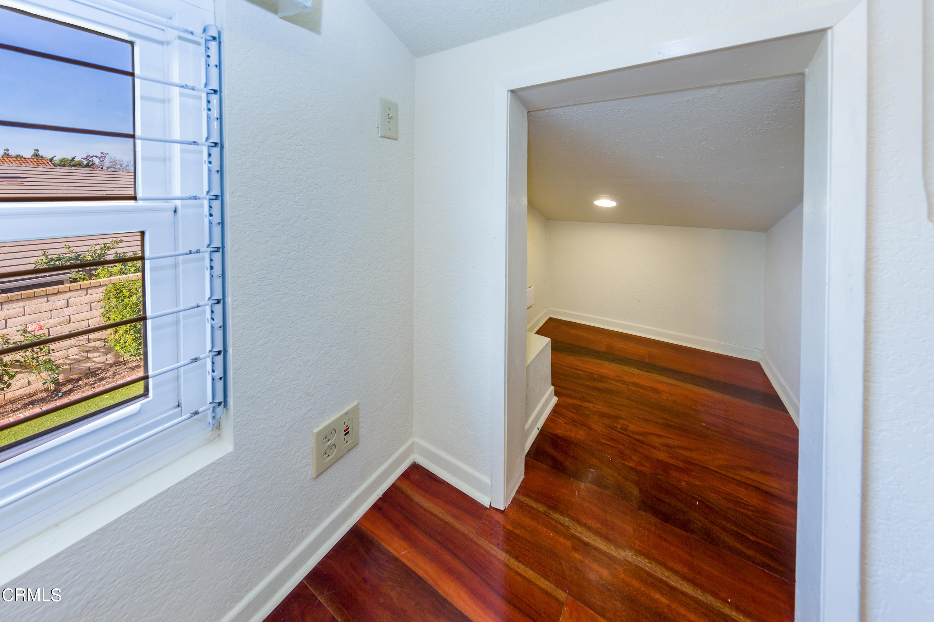 6025 Palomar Circle Camarillo, CA 93012 - Photo 27 of 35 a view of an empty room with wooden floor and a window