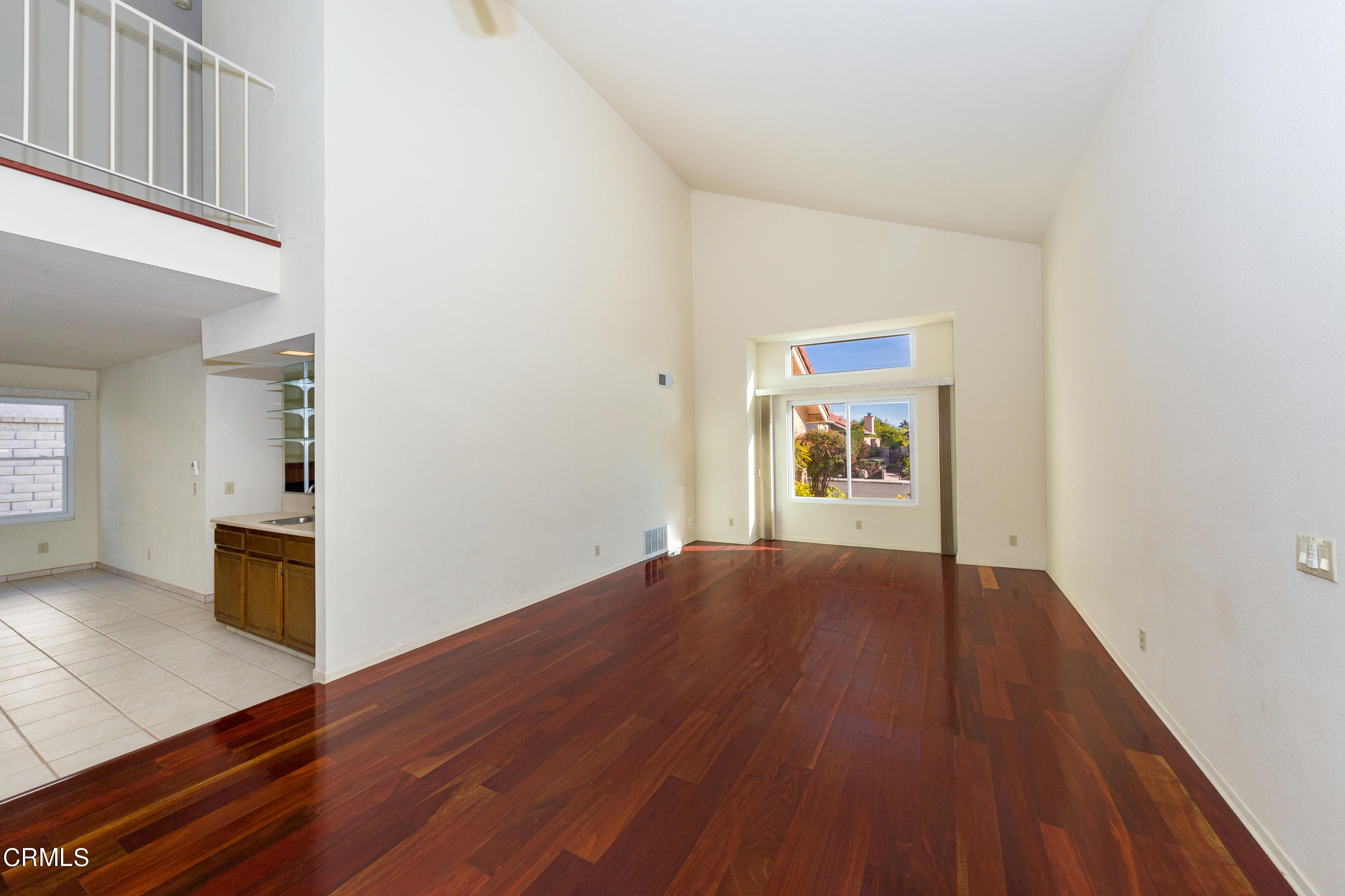 6025 Palomar Circle Camarillo, CA 93012 - Photo 5 of 35 a view of an empty room with window and wooden floor
