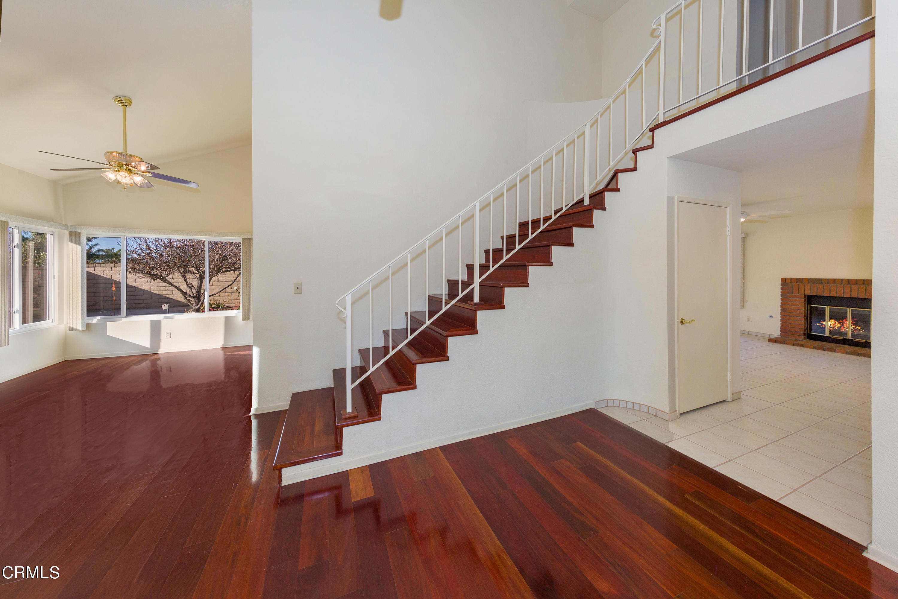 6025 Palomar Circle Camarillo, CA 93012 - Photo 7 of 35 a view of staircase with wooden floor and a rug