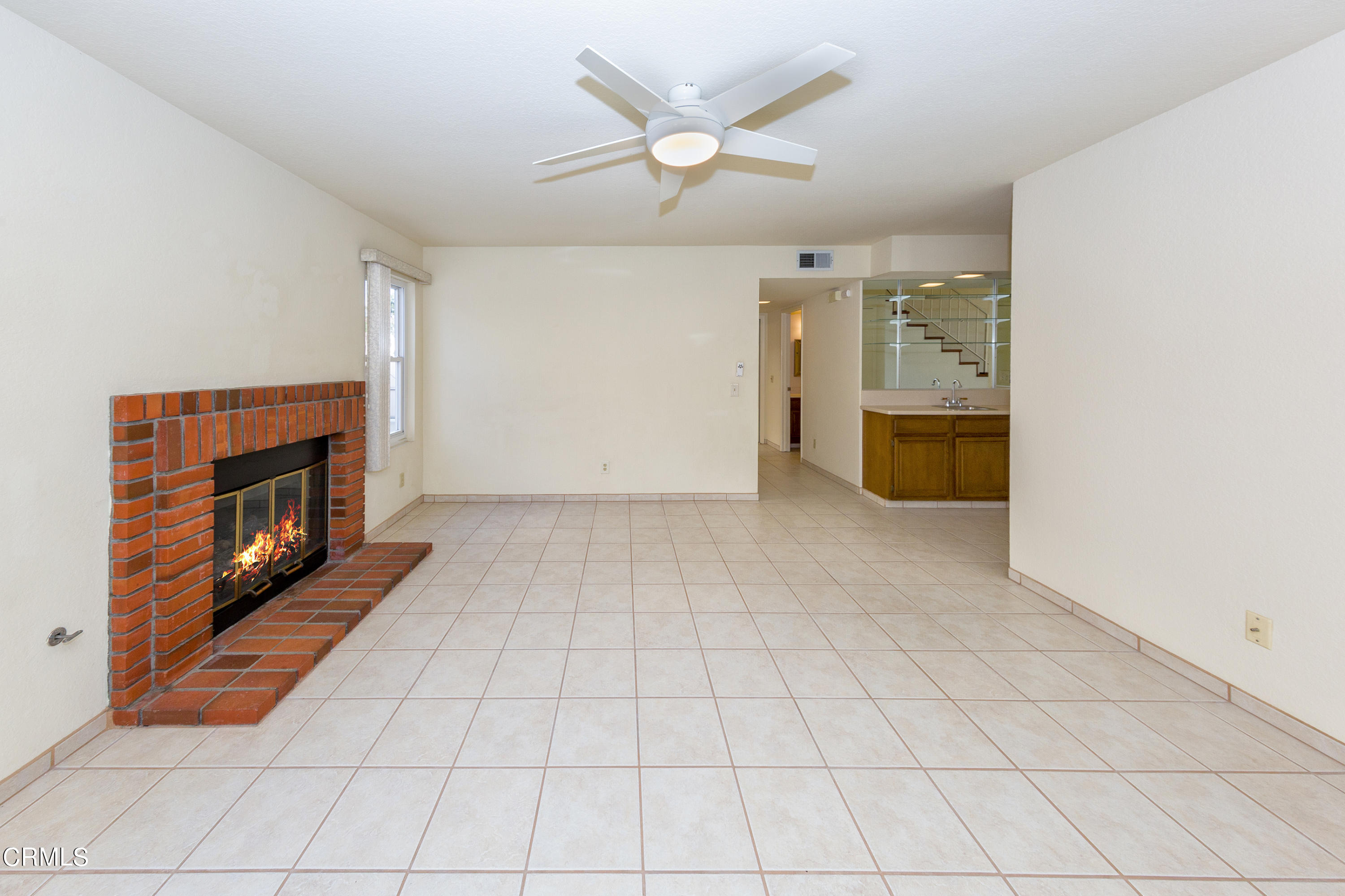 6025 Palomar Circle Camarillo, CA 93012 - Photo 9 of 35 an empty room with windows and fireplace