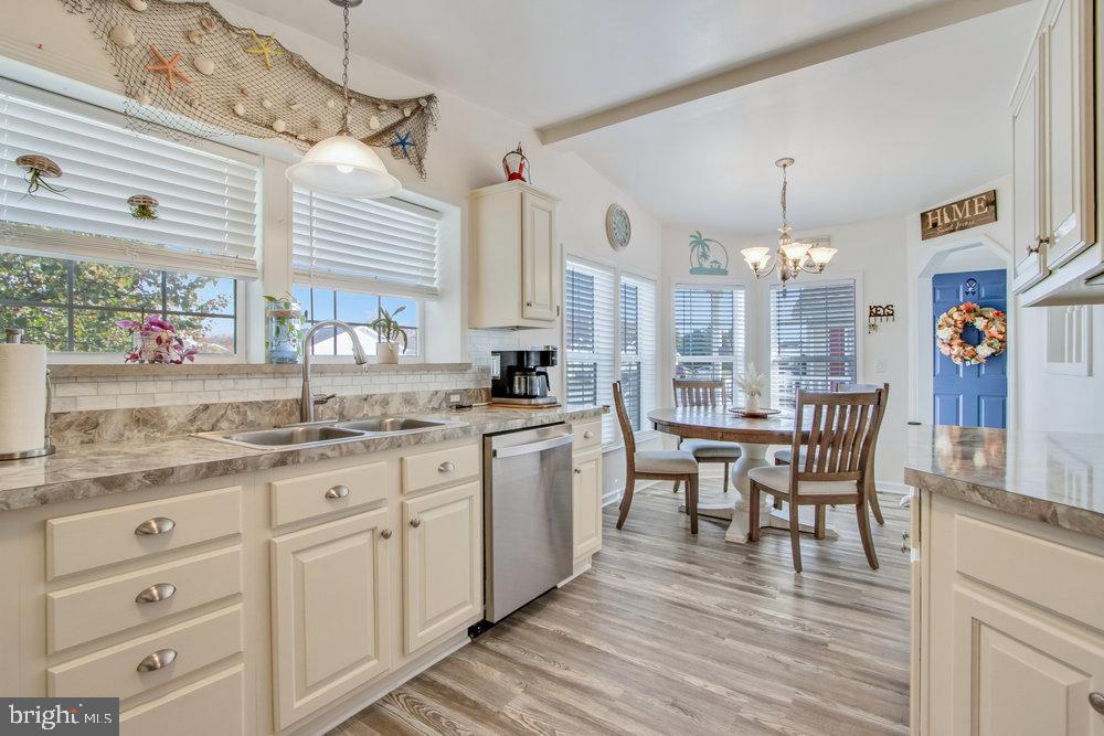 1125 Lorenzo Lane, Unit 274 Smyrna, DE 19977 - Photo 12 of 43 a kitchen with cabinets and window