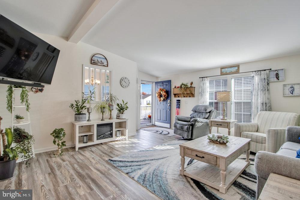 1125 Lorenzo Lane, Unit 274 Smyrna, DE 19977 - Photo 19 of 43 a living room with furniture and a flat screen tv
