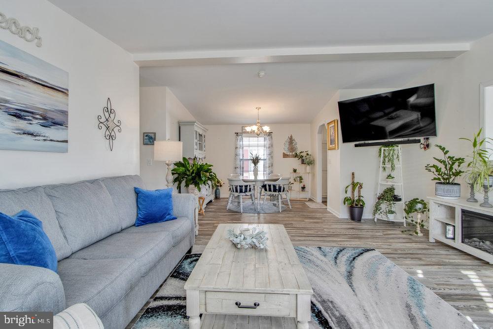 1125 Lorenzo Lane, Unit 274 Smyrna, DE 19977 - Photo 21 of 43 a living room with furniture and a flat screen tv