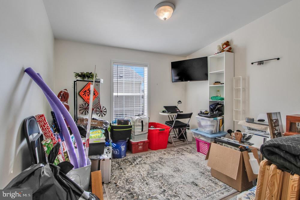 1125 Lorenzo Lane, Unit 274 Smyrna, DE 19977 - Photo 29 of 43 a living room with furniture and a flat screen tv