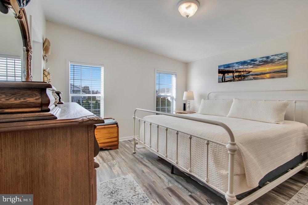 1125 Lorenzo Lane, Unit 274 Smyrna, DE 19977 - Photo 30 of 43 a bedroom with furniture and a window