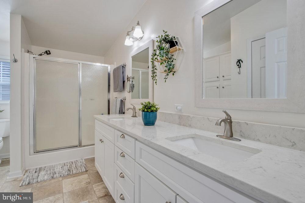 1125 Lorenzo Lane, Unit 274 Smyrna, DE 19977 - Photo 32 of 43 a bathroom with a sink and a mirror