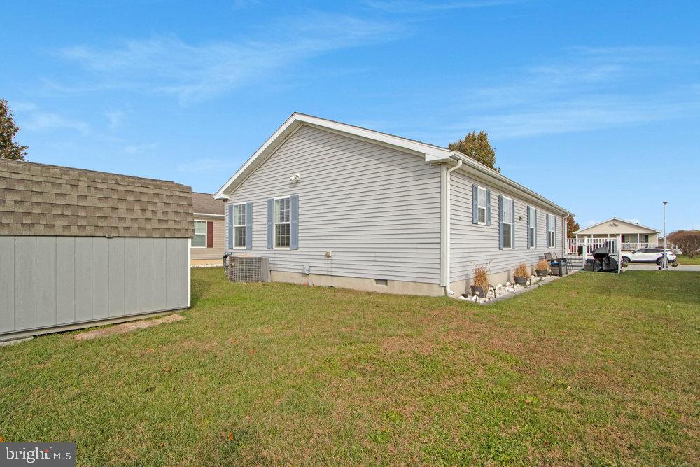 1125 Lorenzo Lane, Unit 274 Smyrna, DE 19977 - Photo 34 of 43 a view of a house with backyard and sitting area