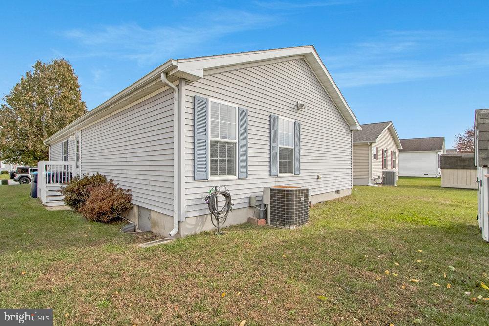 1125 Lorenzo Lane, Unit 274 Smyrna, DE 19977 - Photo 36 of 43 a view of a house with a yard