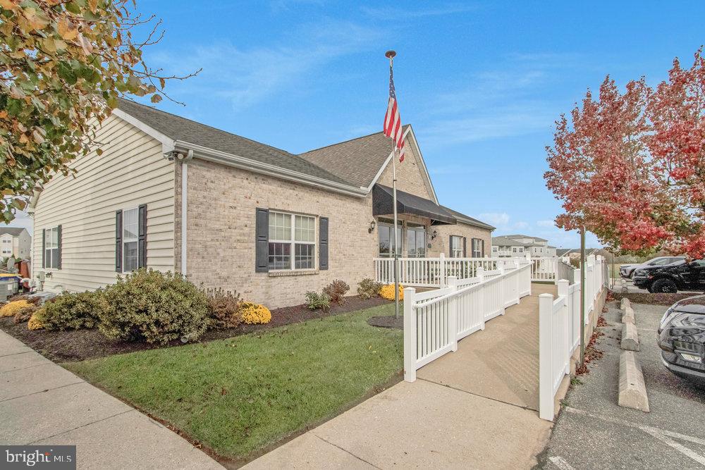 1125 Lorenzo Lane, Unit 274 Smyrna, DE 19977 - Photo 41 of 43 a front view of a house with a garden