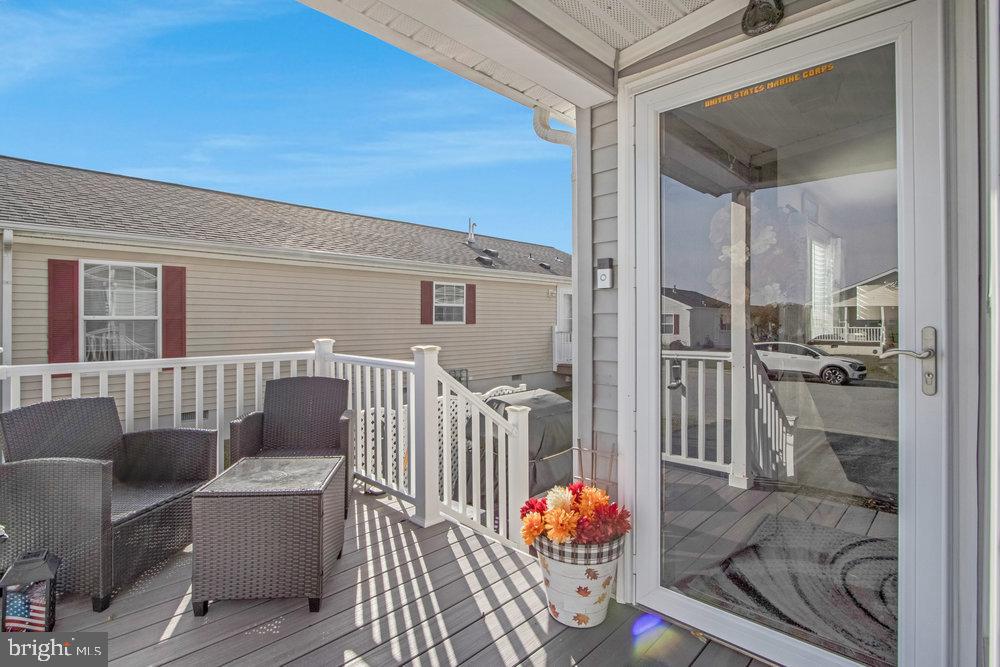 1125 Lorenzo Lane, Unit 274 Smyrna, DE 19977 - Photo 5 of 43 a living room with furniture and a window