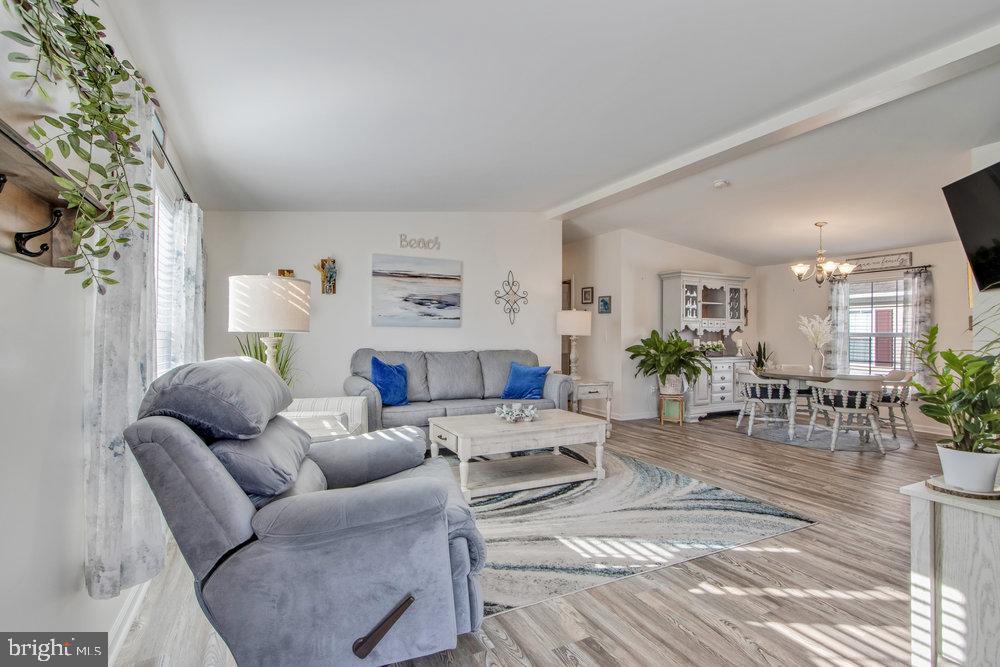 1125 Lorenzo Lane, Unit 274 Smyrna, DE 19977 - Photo 6 of 43 a living room with furniture and a table