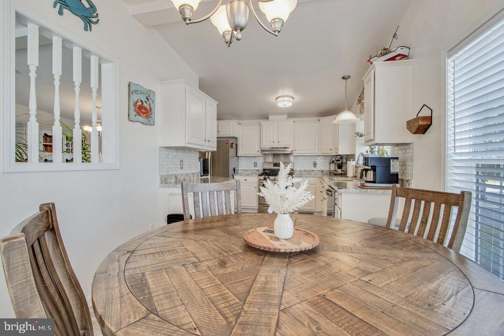 1125 Lorenzo Lane, Unit 274 Smyrna, DE 19977 - Photo 9 of 43 a view of a dining room with furniture