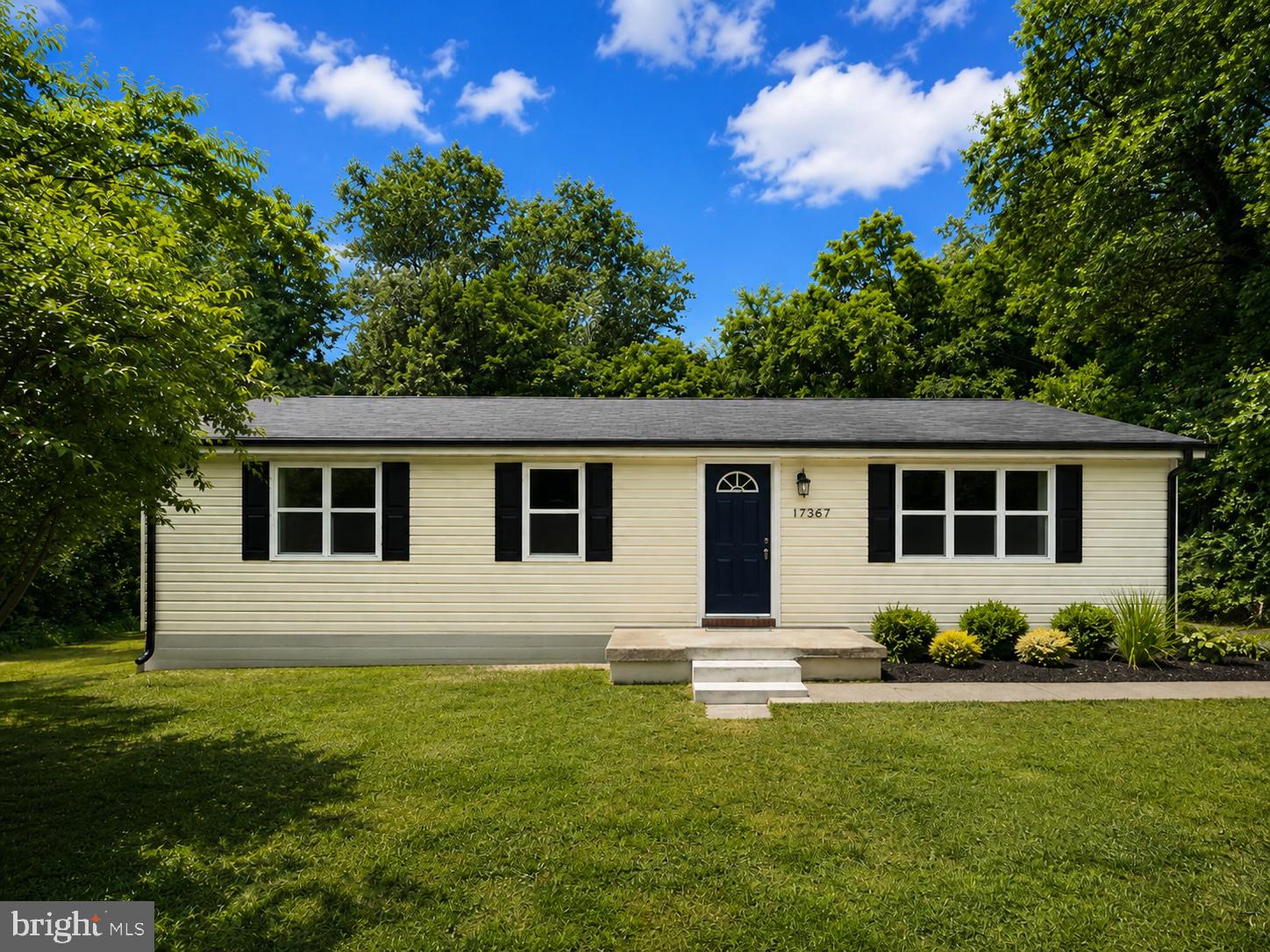 17367 Mt Zion Church Road St. Inigoes, MD 20684 - Photo 1 of 2 a front view of house with yard and green space