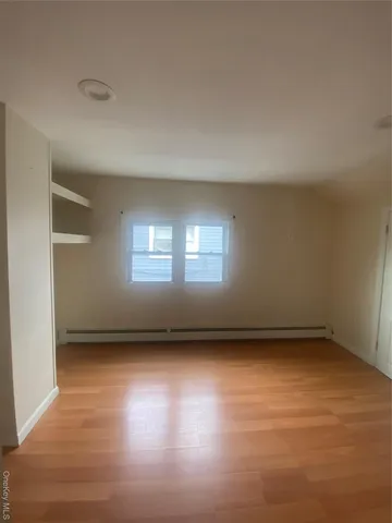 a view of an empty room and window