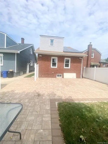 a view of a backyard of the house