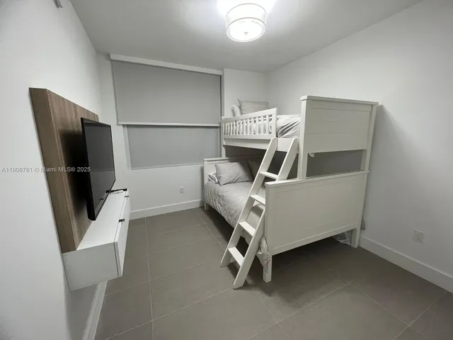 a room with furniture and a flat screen tv