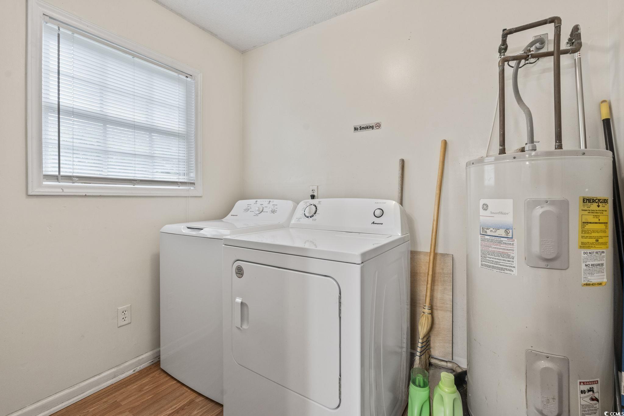 2405 Sherry Avenue Conway, SC 29527 - Photo 11 of 29 Laundry area featuring washer and clothes dryer, water heater, and light wood finished floors