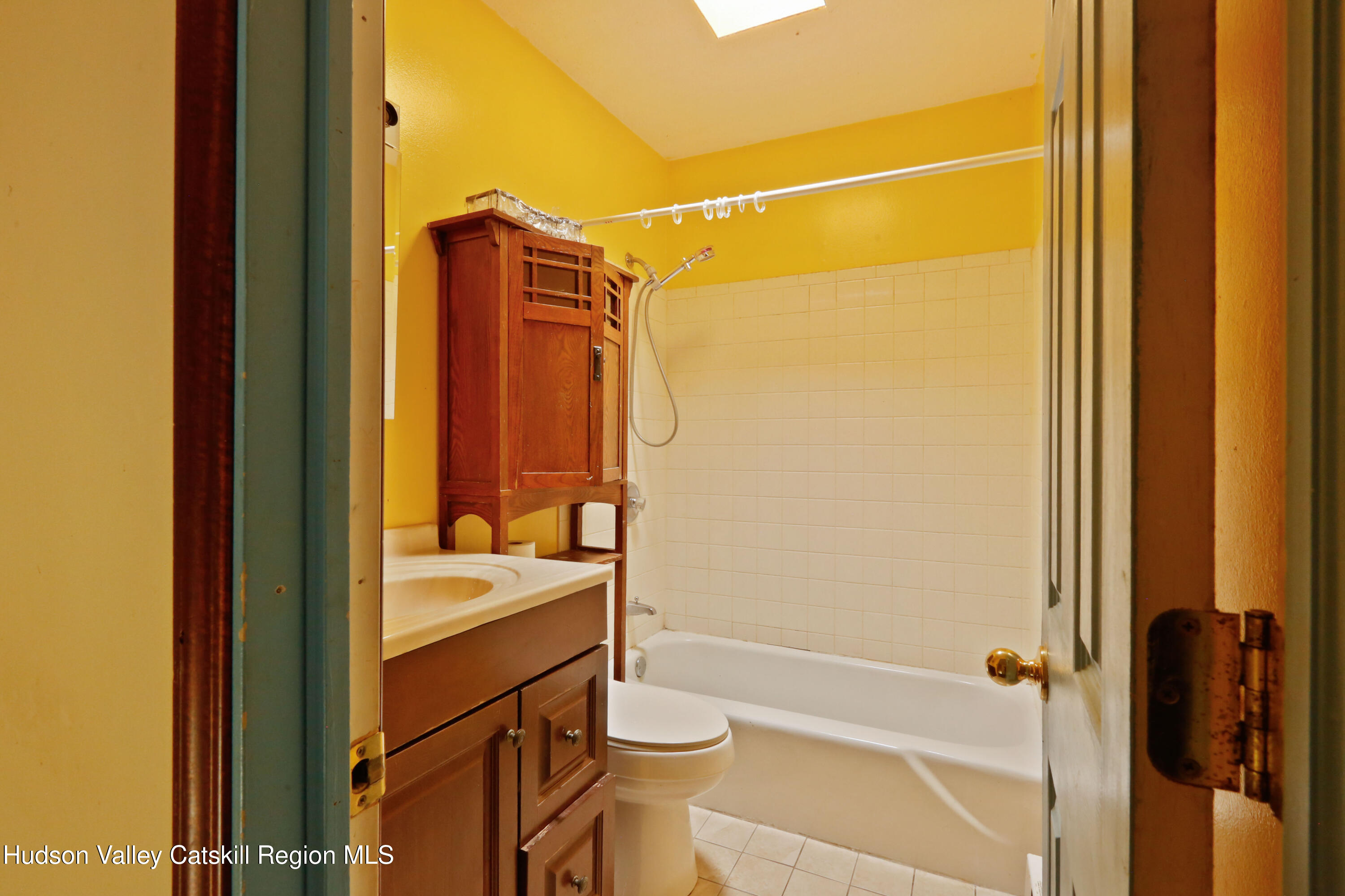 881 Albany Post Road, Unit 5 New Paltz, NY 12561 - Photo 10 of 16 a bathroom with a shower and a sink