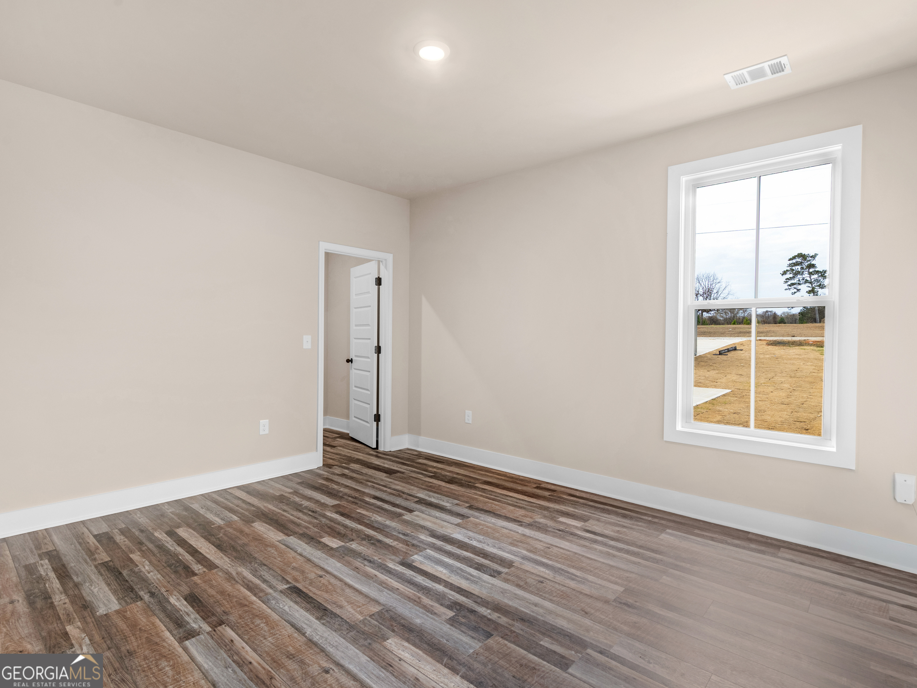 160 Loyd Road Mansfield, GA 30056 - Photo 37 of 53 an empty room with wooden floor and a window