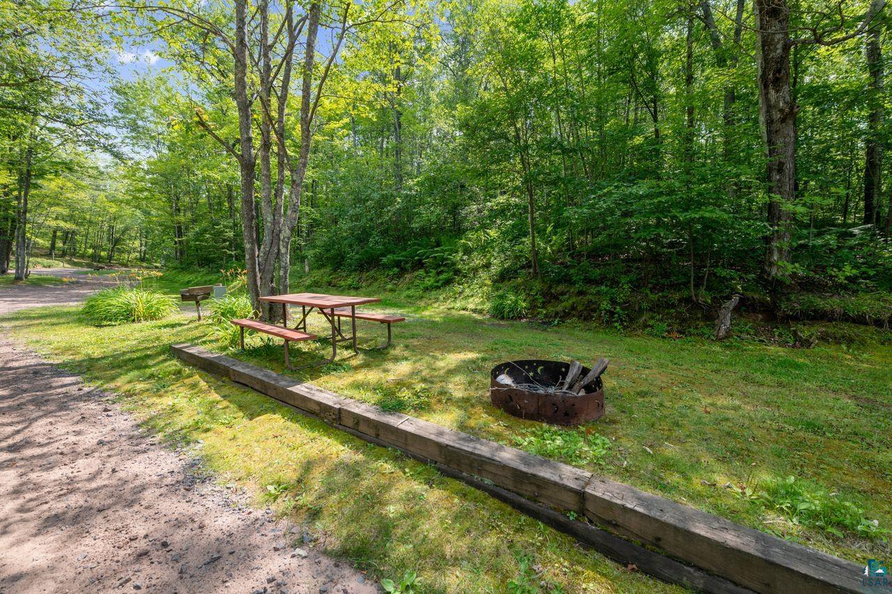 9505 Wildwood Campground Road Iron River, WI 54847 - Photo 16 of 34 View of yard with an outdoor fire pit