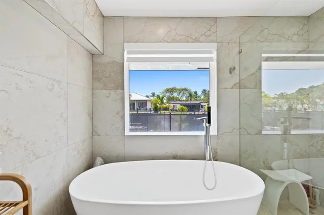 a white bath tub sitting in a bathroom