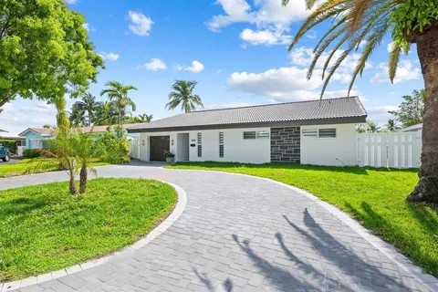 a view of house with a garden