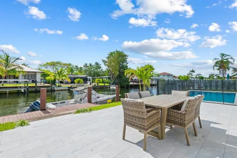 a view of a swimming pool with lounge chairs