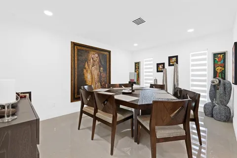 a view of a dining room with furniture and window