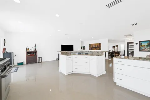 a view of living room with furniture and flat screen tv