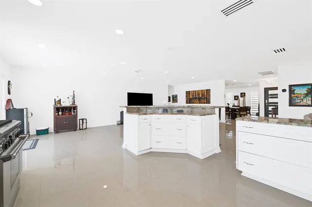 a view of living room with furniture and flat screen tv