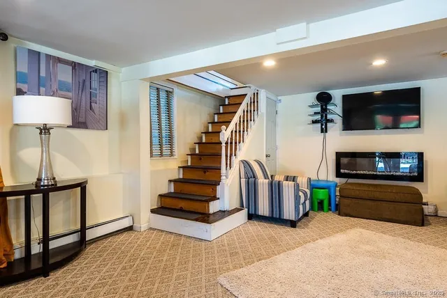 a view of an entryway with fireplace and a workspace