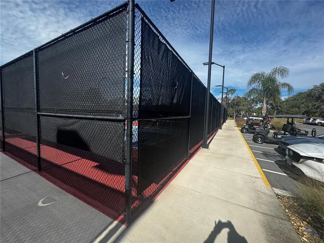 a balcony with view of car parked
