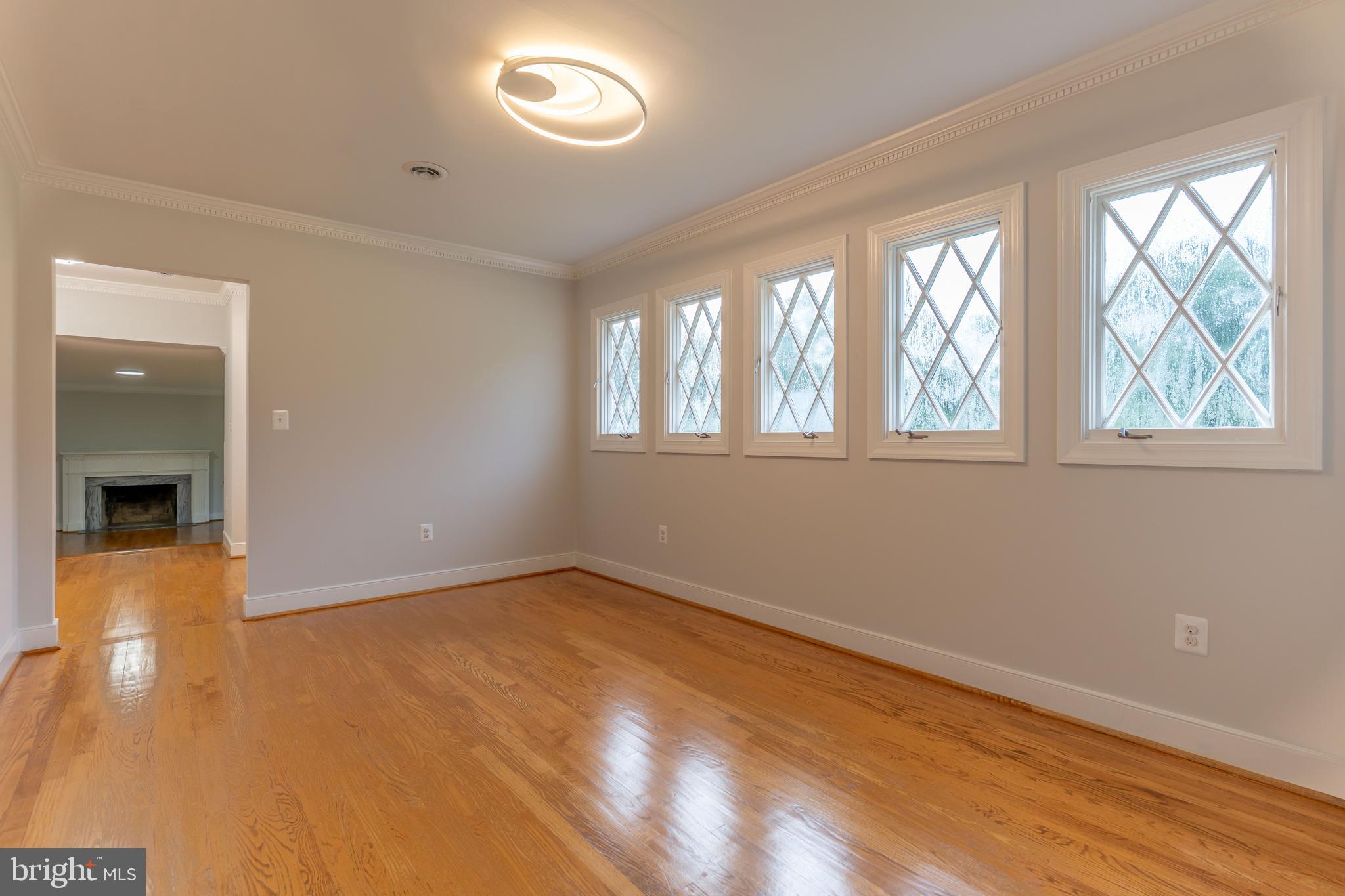 142 Woodland Road Fredericksburg, VA 22401 - Photo 14 of 49 an empty room with wooden floor and windows