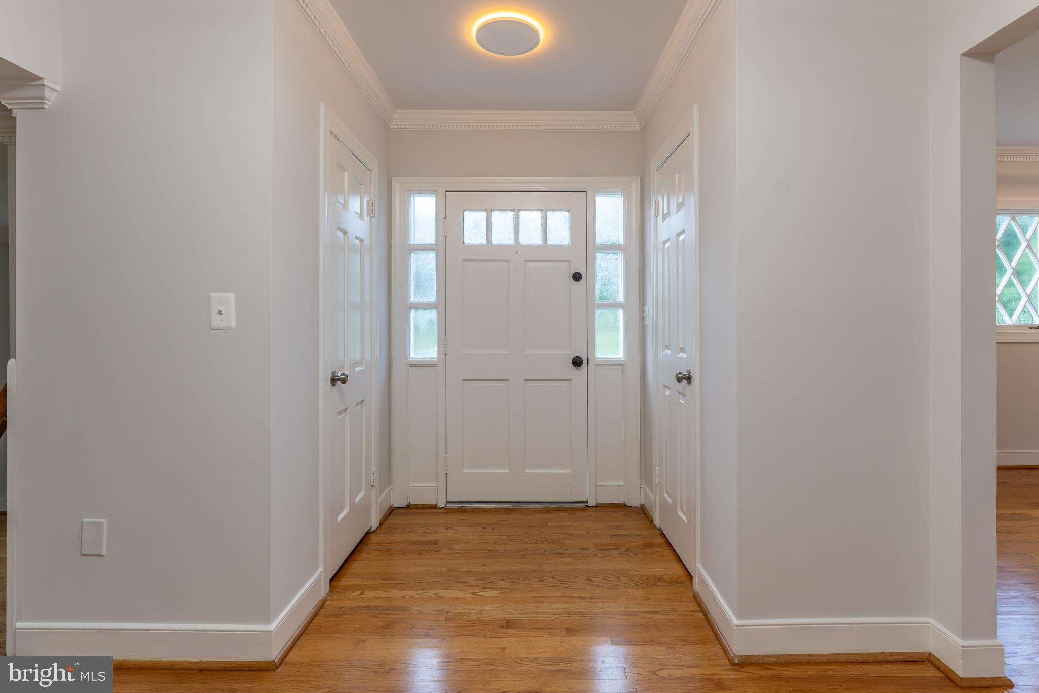 142 Woodland Road Fredericksburg, VA 22401 - Photo 16 of 49 an empty room with wooden floor and windows