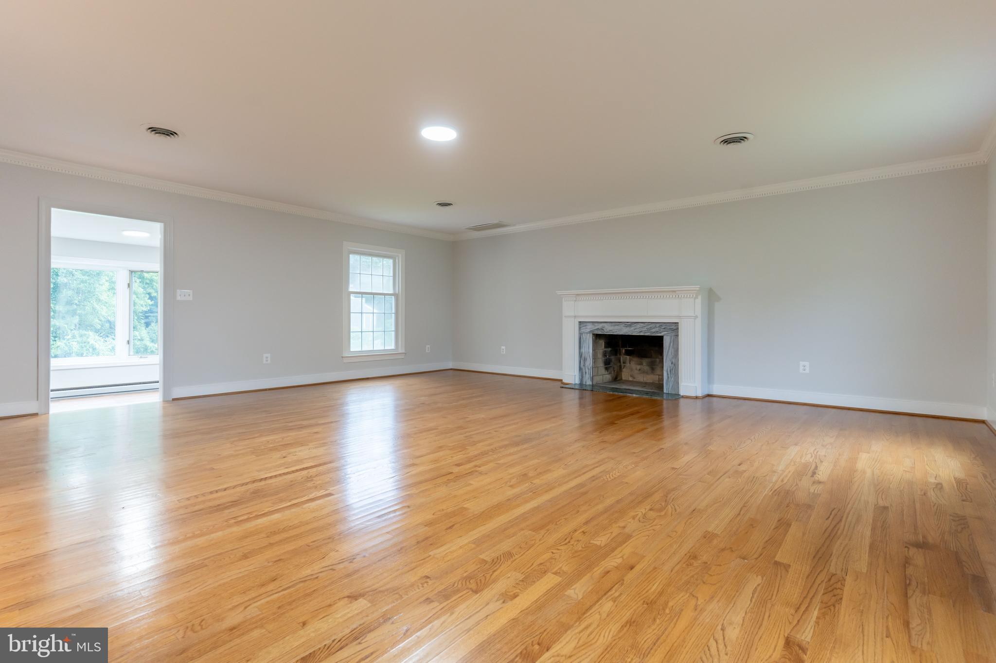 142 Woodland Road Fredericksburg, VA 22401 - Photo 19 of 49 a view of empty room with wooden floor and fireplace