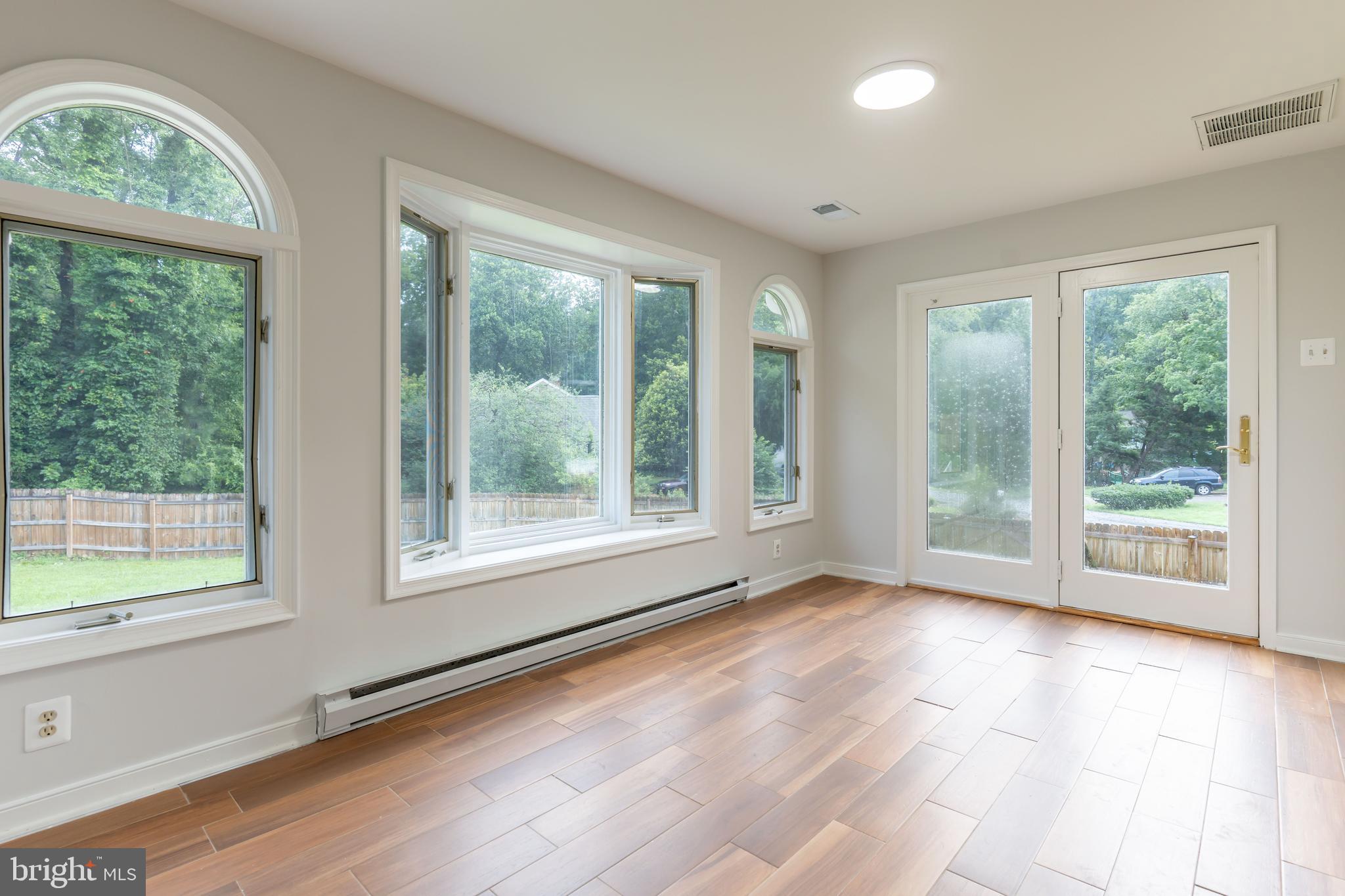 142 Woodland Road Fredericksburg, VA 22401 - Photo 20 of 49 a view of an empty room with wooden floor and a window
