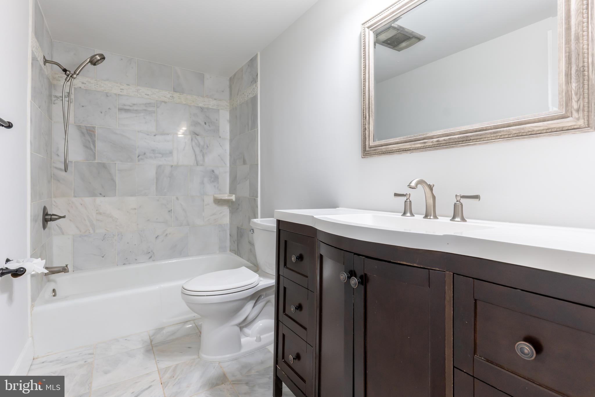142 Woodland Road Fredericksburg, VA 22401 - Photo 24 of 49 a bathroom with a sink a toilet and a bathtub