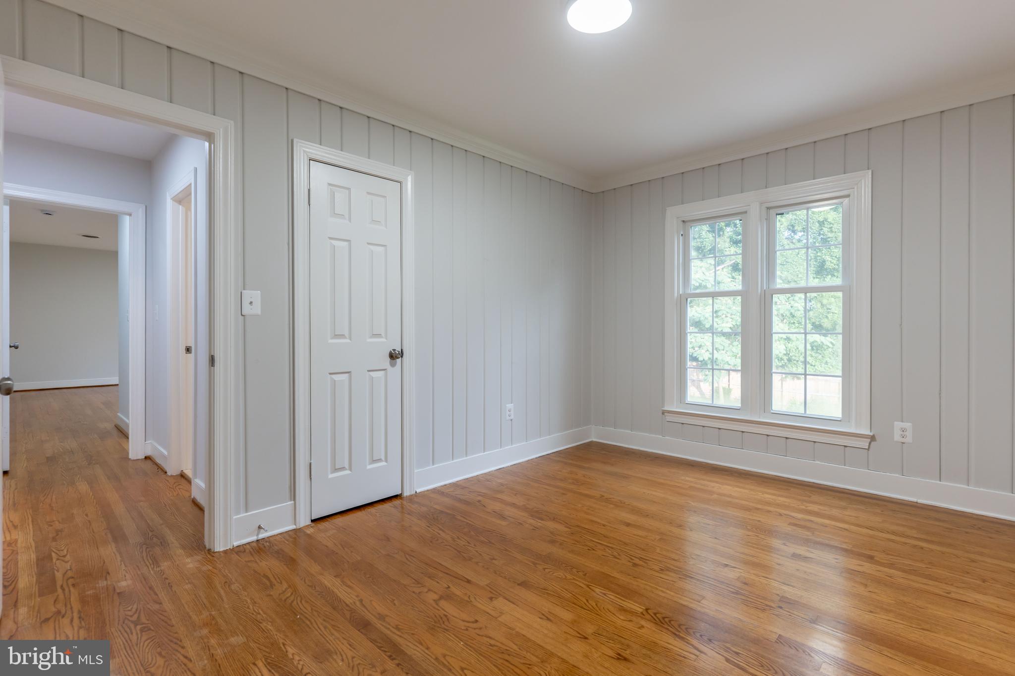 142 Woodland Road Fredericksburg, VA 22401 - Photo 25 of 49 a view of empty room with wooden floor and fan