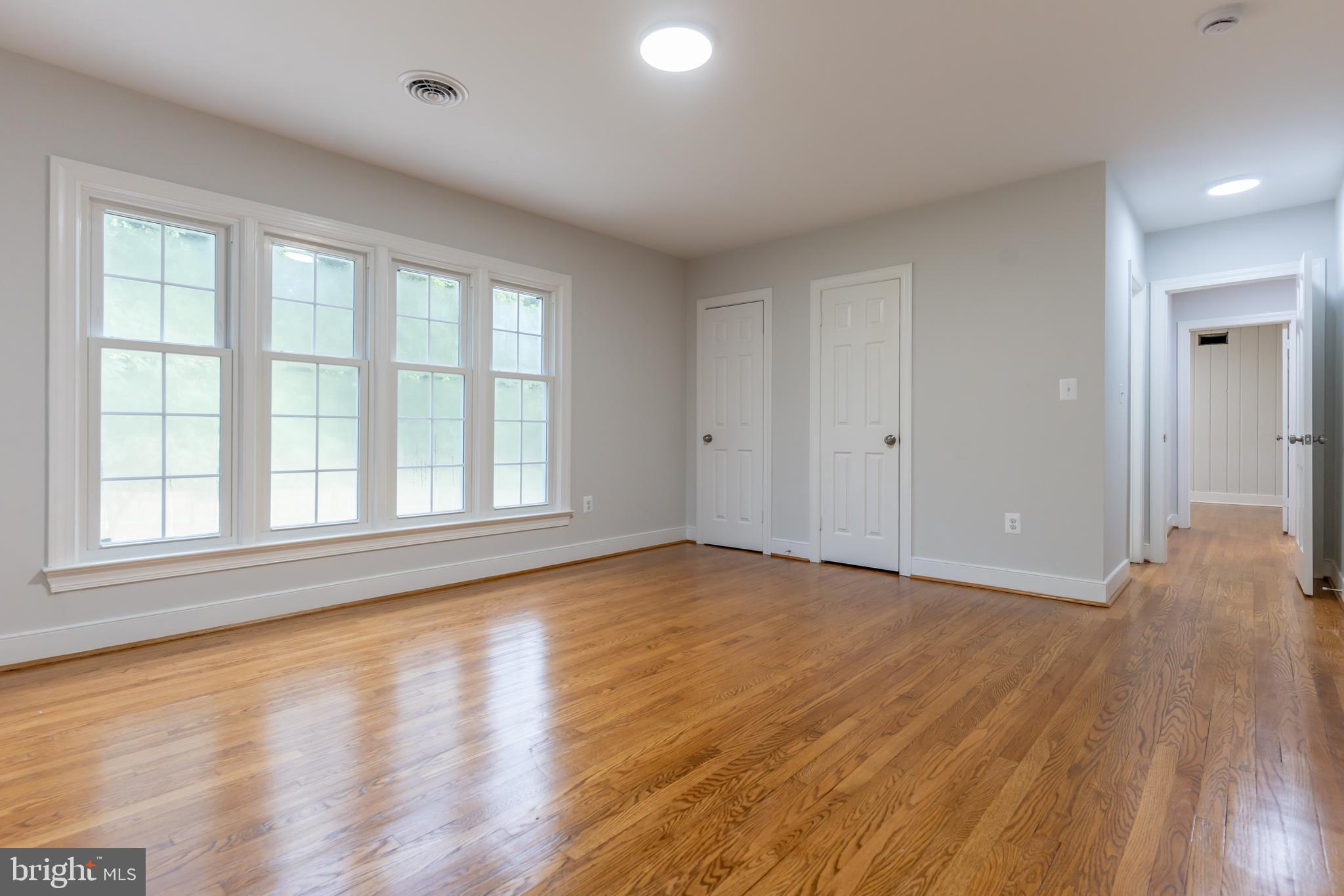 142 Woodland Road Fredericksburg, VA 22401 - Photo 27 of 49 wooden floor in an empty room with a window