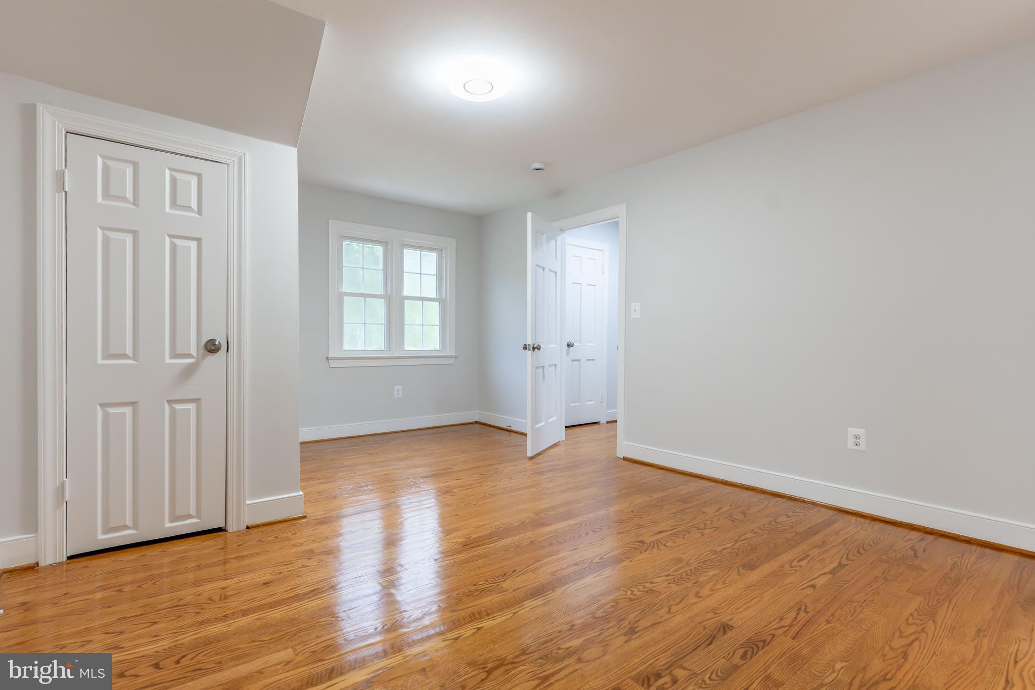 142 Woodland Road Fredericksburg, VA 22401 - Photo 30 of 49 an empty room with wooden floor and windows